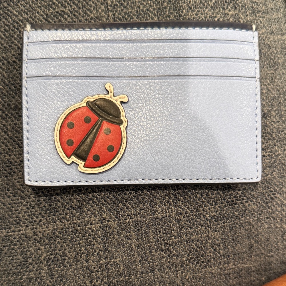 Kate Spade Light Blue Card Holder with Ladybug Design